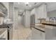 Well lit kitchen featuring stainless appliances, tile flooring, and granite counter tops at 229 Terrane Rdg, Peachtree City, GA 30269
