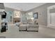 Spacious living room featuring a stone fireplace, large windows, and comfortable seating at 229 Terrane Rdg, Peachtree City, GA 30269