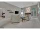 Cozy living room with comfortable seating, decorative shelves, and view of the bedroom at 229 Terrane Rdg, Peachtree City, GA 30269