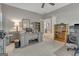 Home office with built-in shelves, grey desk, carpet, and French doors to another room at 229 Terrane Rdg, Peachtree City, GA 30269