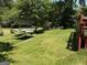 Lush backyard with mature trees, a relaxing hammock, and plenty of space for outdoor activities at 2942 Old Norcross Rd, Tucker, GA 30084