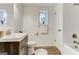 Bathroom features modern fixtures, wood style floors, and white trim at 2942 Old Norcross Rd, Tucker, GA 30084