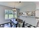 Eat-in kitchen with bay window and checkerboard tile floor at 2942 Old Norcross Rd, Tucker, GA 30084