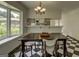 Cozy dining room featuring a modern chandelier and a view into the kitchen area at 2942 Old Norcross Rd, Tucker, GA 30084