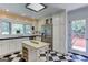 Bright kitchen with island, stainless appliances, and access to deck at 2942 Old Norcross Rd, Tucker, GA 30084