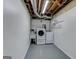 Laundry room features modern washer, dryer, and utility sink at 2942 Old Norcross Rd, Tucker, GA 30084