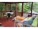 Comfortable screen porch featuring outdoor seating and a porch swing, perfect for relaxation at 2942 Old Norcross Rd, Tucker, GA 30084