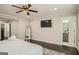 Spacious bedroom with a large bed, mounted TV, and access to a bathroom at 1865 Broadwell Sw St, Atlanta, GA 30310