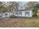 Cozy single-Gathering home featuring a quaint front porch and a well-maintained yard at 1865 Broadwell Sw St, Atlanta, GA 30310