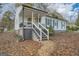 Inviting home showcasing a classic design with a covered porch and updated gray trim at 1865 Broadwell Sw St, Atlanta, GA 30310