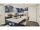 Stylish kitchen featuring blue cabinets, stainless steel appliances, and a breakfast bar island at 1865 Broadwell Sw St, Atlanta, GA 30310