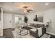 Comfortable living room with an open floor plan, connecting the dining area for easy entertaining at 1865 Broadwell Sw St, Atlanta, GA 30310