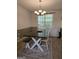 Bright dining area featuring a farmhouse table set, neutral walls, and natural light at 220 Jackson Rd, Mcdonough, GA 30252