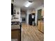 An efficiency kitchen featuring updated appliances, plenty of cabinet space, and hardwood floors at 220 Jackson Rd, Mcdonough, GA 30252