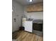 Laundry room with washer, dryer, and storage cabinets at 220 Jackson Rd, Mcdonough, GA 30252