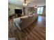Spacious living room featuring hardwood floors, ceiling fans, and large windows at 220 Jackson Rd, Mcdonough, GA 30252