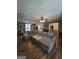 A spacious open-concept room featuring hardwood floors and a large couch at 220 Jackson Rd, Mcdonough, GA 30252