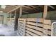 Interior view of the barn featuring multiple stalls at 1100 Kinnett Rd, Covington, GA 30016