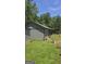 Exterior of a storage shed with a gray painted exterior at 1100 Kinnett Rd, Covington, GA 30016