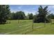 Expansive property line with wooden fencing and lush greenery at 1100 Kinnett Rd, Covington, GA 30016