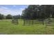 Large, fenced lot surrounded by mature trees at 1100 Kinnett Rd, Covington, GA 30016