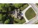 Aerial view showcasing the house's backyard deck, lush landscaping, expansive lawn, and circular driveway at 9742 Fallview Ct, Villa Rica, GA 30180