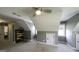 This attic area is carpeted, and has windows and a ceiling fan at 9742 Fallview Ct, Villa Rica, GA 30180