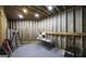 Unfinished basement with exposed framing, concrete floor and ladder at 9742 Fallview Ct, Villa Rica, GA 30180