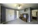 This bedroom has neutral carpet, a ceiling fan, closet and is painted in a light grey tone at 9742 Fallview Ct, Villa Rica, GA 30180