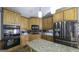 Modern kitchen featuring wooden cabinets, granite countertops, stainless steel appliances, and center island at 9742 Fallview Ct, Villa Rica, GA 30180