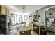 Open kitchen with granite countertops, modern appliances, and an adjacent breakfast nook with large windows at 9742 Fallview Ct, Villa Rica, GA 30180