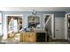 Open-concept kitchen with granite counters, stainless steel dishwasher, and lots of cabinet storage at 9742 Fallview Ct, Villa Rica, GA 30180