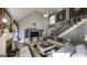 Spacious living room featuring high ceilings, a fireplace, and a staircase leading to the upper level at 9742 Fallview Ct, Villa Rica, GA 30180