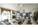Bright and airy living room with vaulted ceilings, fireplace, and cozy seating arrangement at 9742 Fallview Ct, Villa Rica, GA 30180