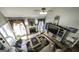 High-angle view of living room with fireplace, staircase, and TV at 9742 Fallview Ct, Villa Rica, GA 30180