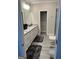 Bathroom with granite countertops, double sinks, and gray flooring at 3608 Davenport Rd, Duluth, GA 30096