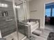 Bathroom with a shower, soaking tub, and gray tile at 3608 Davenport Rd, Duluth, GA 30096
