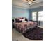 Bright bedroom with two large windows and tray ceiling at 3608 Davenport Rd, Duluth, GA 30096