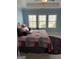 Bedroom with three windows and decorative bedspread at 3608 Davenport Rd, Duluth, GA 30096