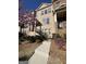 Brick townhome with a walkway, front yard landscaping, and flowering trees at 3608 Davenport Rd, Duluth, GA 30096