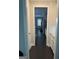 Hallway with dark wood floors that leads to a spacious kitchen at 3608 Davenport Rd, Duluth, GA 30096