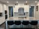 Spacious kitchen with granite island, stainless appliances and white cabinets at 3608 Davenport Rd, Duluth, GA 30096