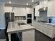 Bright kitchen featuring granite countertops, stainless steel appliances, and white cabinetry at 3608 Davenport Rd, Duluth, GA 30096