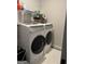 Bright laundry room featuring front loading washer and dryer at 3608 Davenport Rd, Duluth, GA 30096
