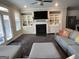 Cozy living room featuring a fireplace, built-in shelving, and comfortable seating at 3608 Davenport Rd, Duluth, GA 30096