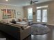Bright living room featuring a large sectional sofa and access to the outdoor patio at 3608 Davenport Rd, Duluth, GA 30096