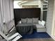 Covered outdoor porch area featuring gray wicker seating, privacy screen, and open view at 3608 Davenport Rd, Duluth, GA 30096