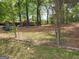 View of fenced-in backyard showing playground and chain-link fence near a home at 957 Astor Ave, Forest Park, GA 30297