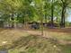 View of backyard featuring playground equipment and chain-link fence at 957 Astor Ave, Forest Park, GA 30297