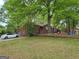 Picture of the yard with a house and play area; car in the driveway at 957 Astor Ave, Forest Park, GA 30297